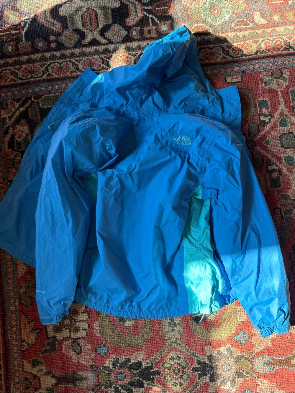 The North Face Women’s Blue and Aqua Hooded Rain Jacket
